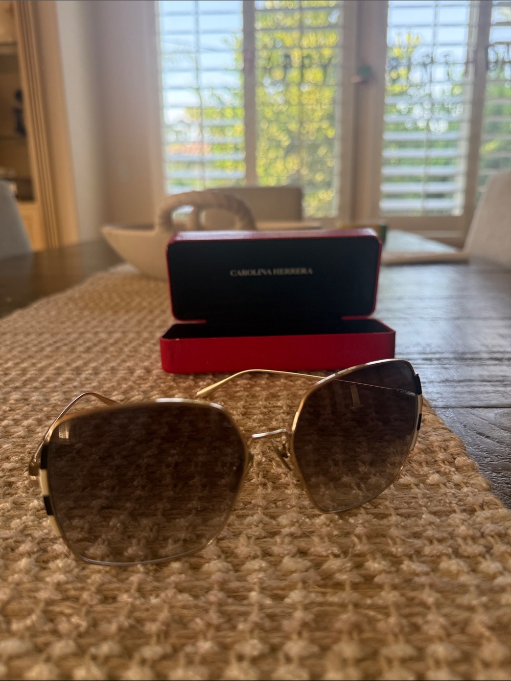 Carolina Herrera Gold Frame Sunglasses with Brown Gradient Lenses